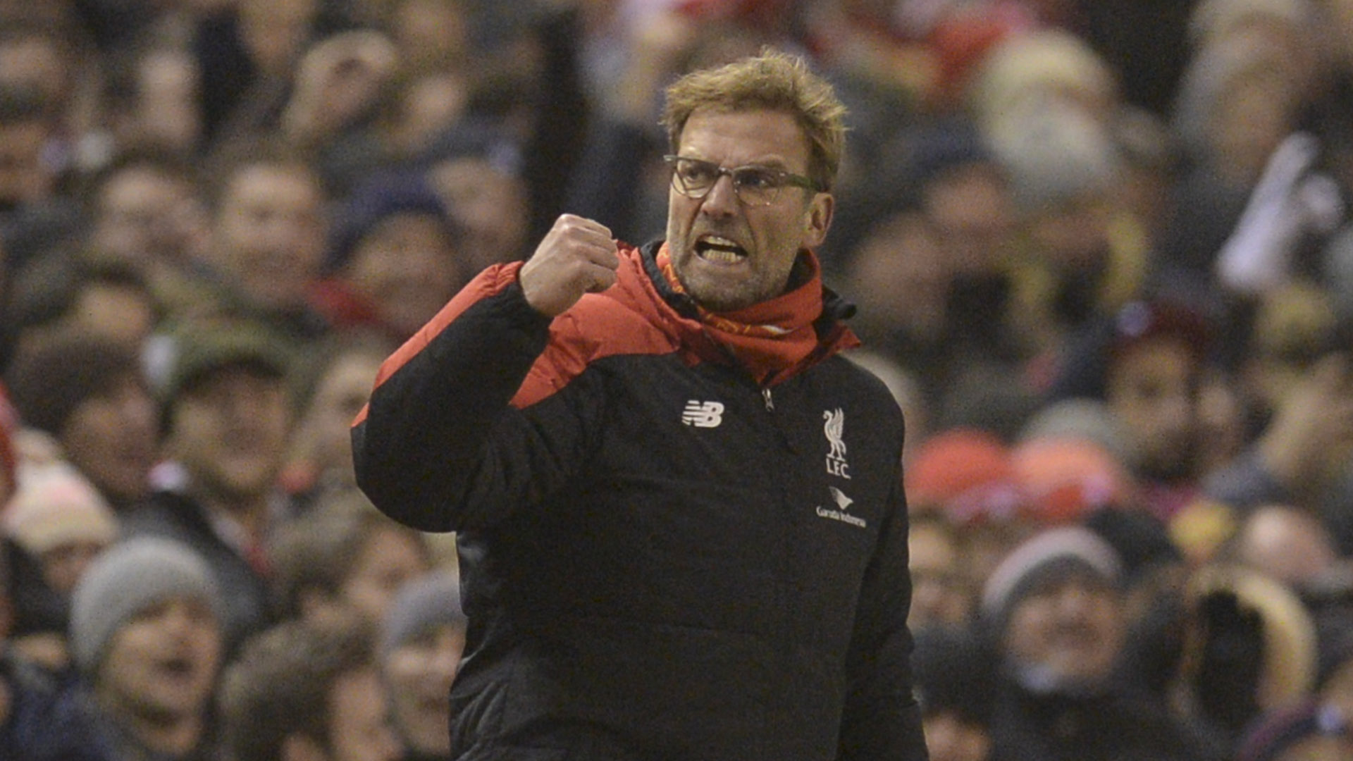 Liverpool's German manager Jurgen Klopp celebrates their late equalising goal to level the score at 2-2 the English Premier League football match between Liverpool and West Bromwich Albion at Anfield in Liverpool, northwest England, on December 13, 2015. AFP PHOTO / OLI SCARFF RESTRICTED TO EDITORIAL USE. No use with unauthorized audio, video, data, fixture lists, club/league logos or 'live' services. Online in-match use limited to 75 images, no video emulation. No use in betting, games or single club/league/player publications. / AFP / OLI SCARFF (Photo credit should read OLI SCARFF/AFP/Getty Images)