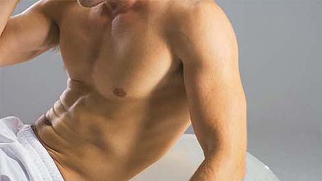 Man doing crunches on exercise ball
