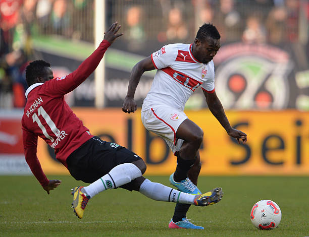 HANNOVER, GERMANY - APRIL 07: Didier Ya Konan of Hannover is challenged by Arthur Boka of Stuttgart during the Bundesliga match between Hannover 96 v VfB Stuttgart at AWD Arena on April 7, 2013 in Hannover, Germany. (Photo by Stuart Franklin/Bongarts/Getty Images)