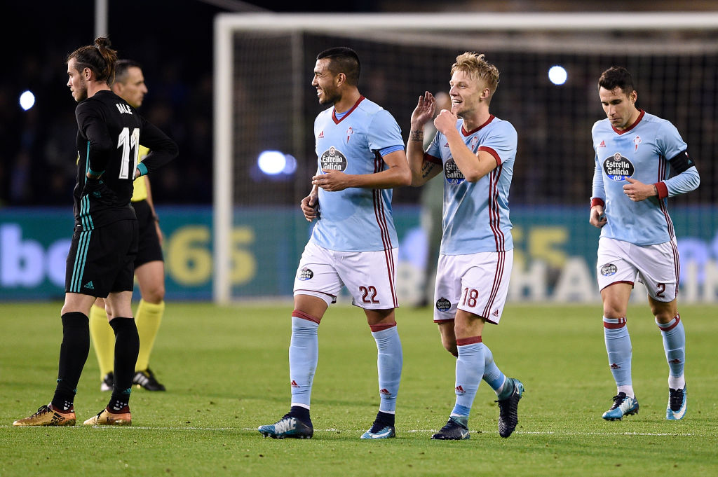 VIGO, SPAIN - JANUARY 07: Daniel Wass (2-R) of RC Celta de Vigo celebrates with team mates after scores the first goal during the La Liga match between RC Celta de Vigo and Real Madrid at Municipal Balaidos on January 7, 2018 in Vigo, . (Photo by Octavio Passos/Getty Images)