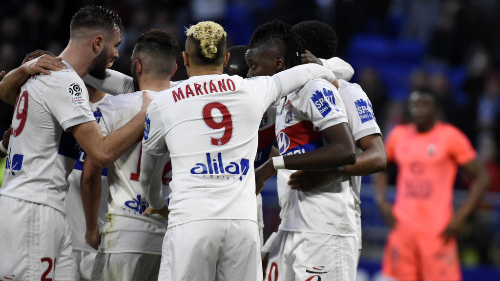 Lyon's players celebrates after scoring a goal during the French L1 football match between Lyon (OL) and Caen (SMC) on March 11, 2018, at the Groupama Stadium in Decines-Charpieu, near Lyon, southeastern France. / AFP PHOTO / JEAN-PHILIPPE KSIAZEK